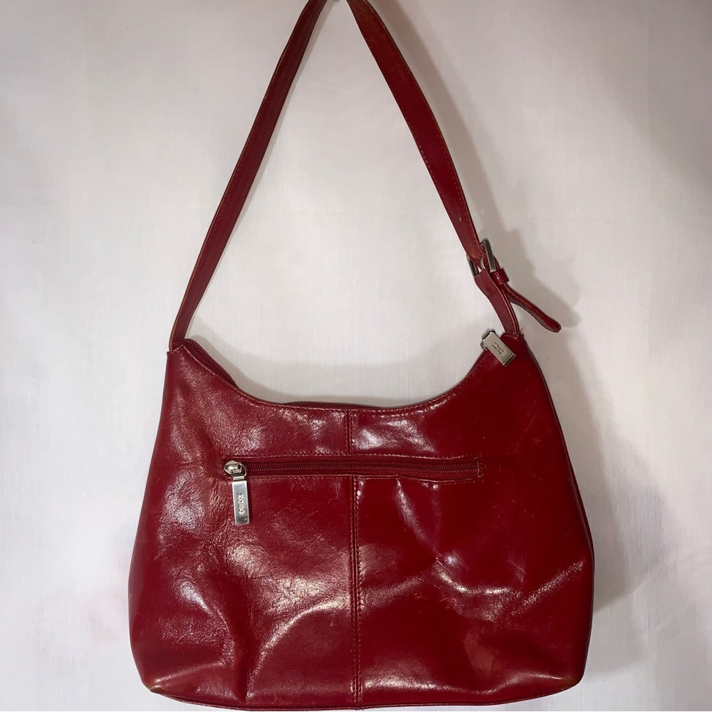 Polished leather Hobo brand purse in medium red.